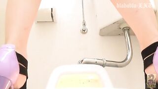 Kinky looking Japanese babe caught shitting in toilet