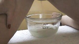 Lovely babe with shaved pussy teasing and pissing