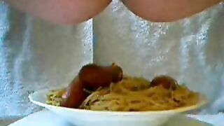 Adding the Poop Sauce on noodles