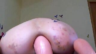 Massive rubber dildo in her horny asshole