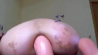 Massive rubber dildo in her horny asshole