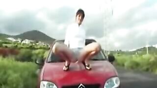 Slut pissing on the car