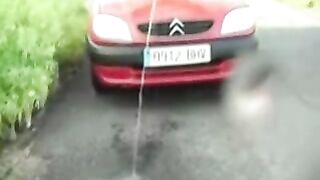 Slut pissing on the car