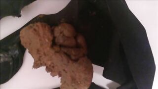 Girl in black panties shits