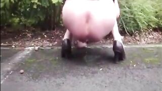 Blonde mature shitting an hard turd in a public