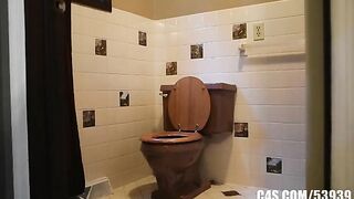 Brunette shits while reading a book