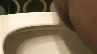 Ebony chcik pooping in the toilet