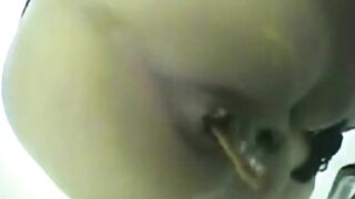Fingering her juicy asshole while shitting