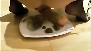 Girl masturbating asshole with dildo while shit eating