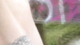 Goth slut pissing in the park