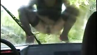 Babe pissing over a car hood
