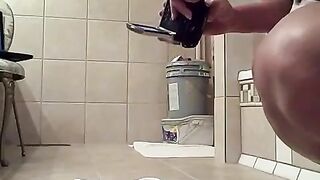 Ebony lady shitting closeup