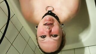 Girl tortures her own ass in the shower with anal hooks.