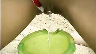 Hot Sahara pissing in sandbox