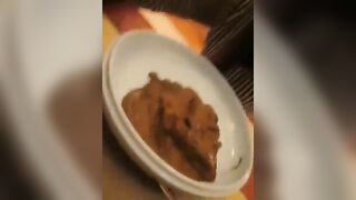 Crazy chick eating a plate of shit