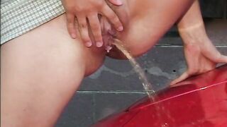 Two nasty girls pissing on corvette