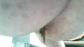 A woman takes a huge piss on the car stereo