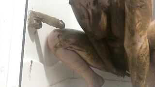 Big tits babe smearing shit on her sexy body