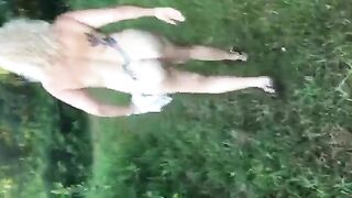 Beautiful blonde curvy naked babe pissing in the woods