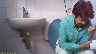 Granny on toilet shitting