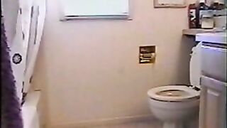 Amateur brunette lady shitting in the toilet
