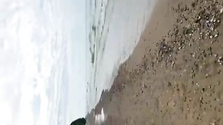 Mature lady with hat pissing on the hill