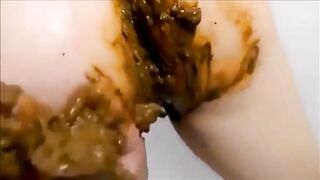 Milf smearing shit on her body while masturbating