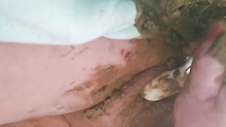 Playing with her green sticky shit