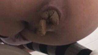 Slutty lady dropping hard turd