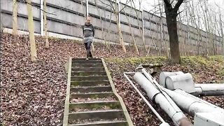 Cute looking blonde girl pissing outdoor