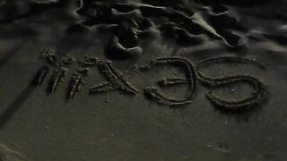 Party gal peeing at beach