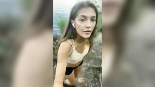 Cute brunette babe pee by the River