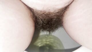Amateur hairy lady pissing in the toilet