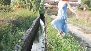 Pretty girl peeing in streams Outdoor