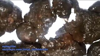 Stunning hot blonde girl showing her black turds