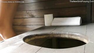 Dropping pee and poop in the wooden toilet outdoor