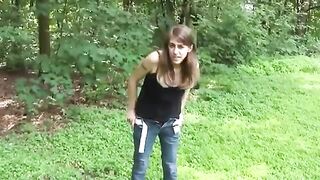 Brunette girlfriend pooping on the grass