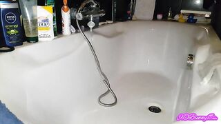 Naked brunette lady shitting nice dark load in the bathtub