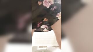MILF shitting long turd in the condom