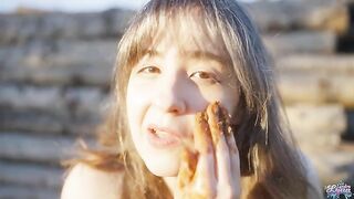 Woman squatting, pissing and playing with her shit in a pink dress