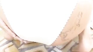 Woman spreads ass on toilet pissing with white panties