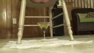 Busty chick shitting from wooden chair
