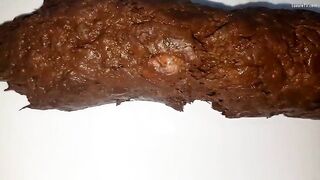 Girl with shit-filled ass and pussy gets fucked with dildo
