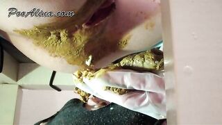 Woman eats her own turd while sitting on her couch