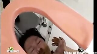 Girl squats and shits in her mouth in an industrial machine.