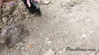 Girl squats and drops a pile of shit outside