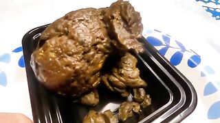 Girl takes a huge shit in a tray