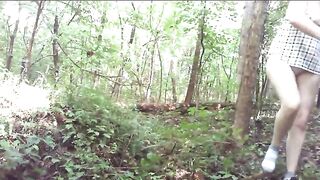 Guy squats, shits in the woods, girl stands over it