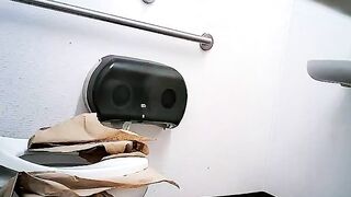 Woman takes a shit through a hole in the wall