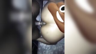Woman with poop emoji face mask fucks her ass with an object.